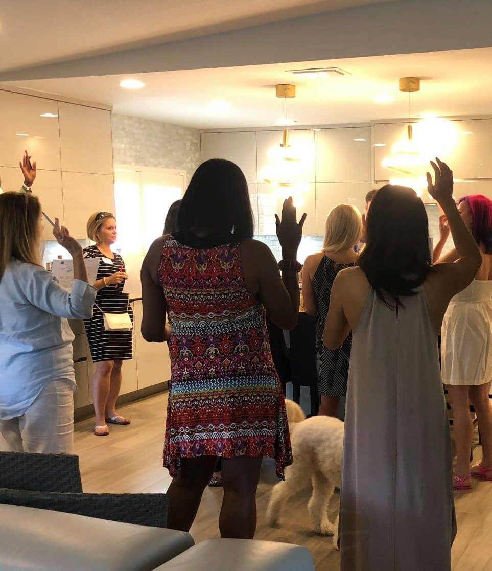 mind mapping group photo retreat discussion with hands raised