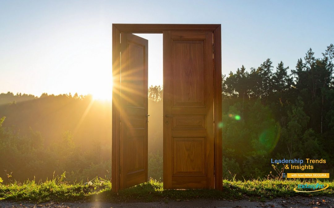 The Question Strong Leaders Ask. Outdoor scene of looking over a lawn with trees in the background. The sun is low on the horizon and bright. With a Wooden door opened in the middle of the image to represent opportunities.